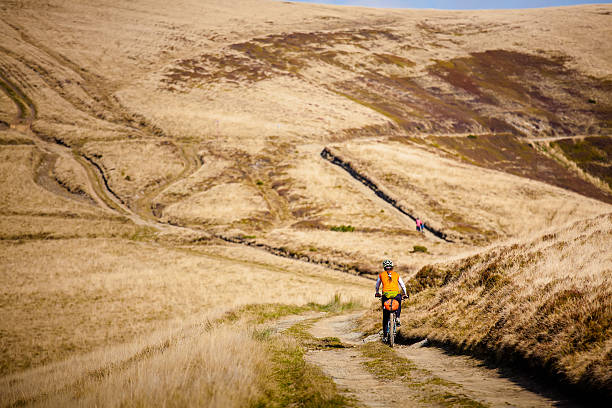 istock Biker riding in autumn mountains 518223620