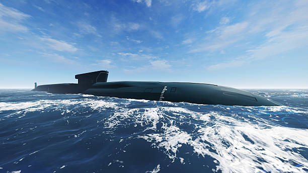 istock Surfaced nuclear submarine at open sea 518223836