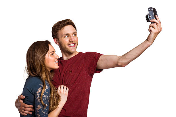 istock Couple taking selfie with digital camera 518223939