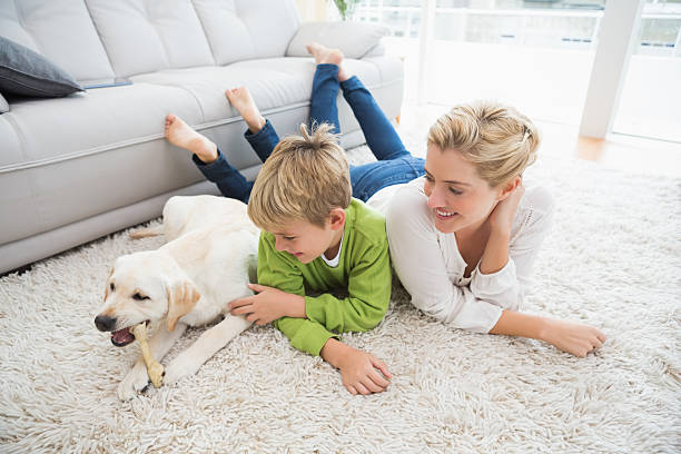 istock Happy mother and son with puppy 518224059