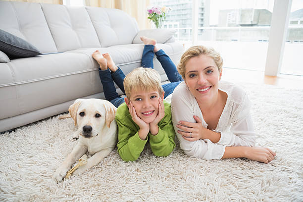 istock Happy mother and son with puppy 518224063