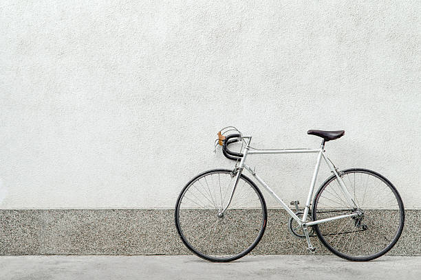 Ready Vintage sport bicycle next to white wall. retro bicycle stock pictures, royalty-free photos & images