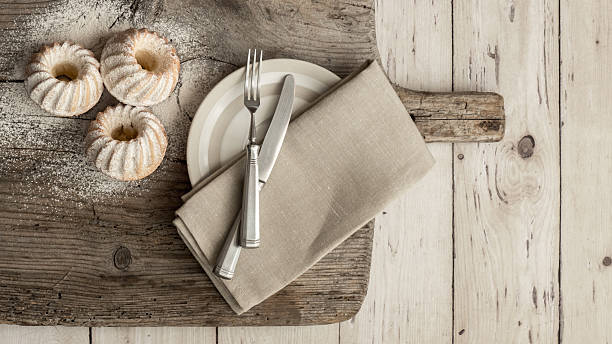 istock Muffins with powdered sugar on wooden board 518224740