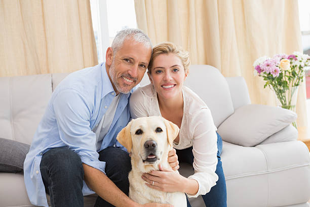 istock Happy couple with their pet dog 518224845