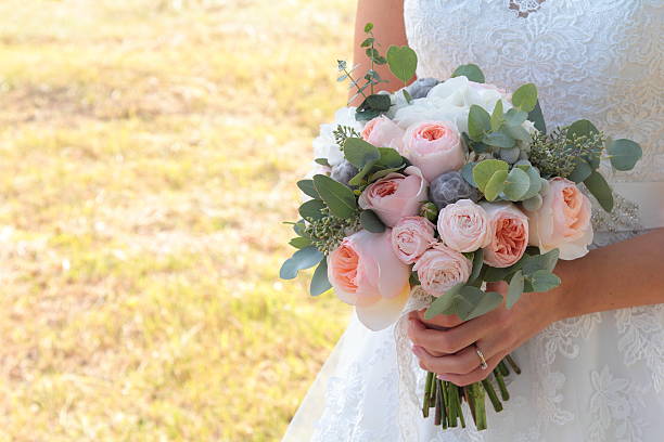 istock Wedding bouquet in hands of the bride 518224869