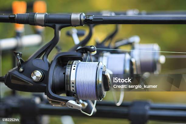Three Fishing Rods With Reel Set Up On Holder Stock Photo - Download Image Now - Activity, Backgrounds, Bicycle Gear