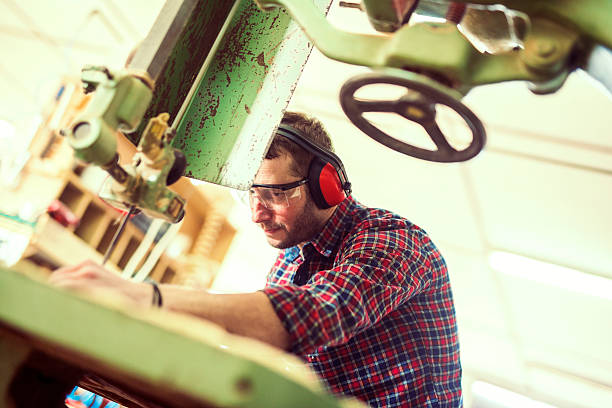 istock Close up of a young carpenter at work 518225992