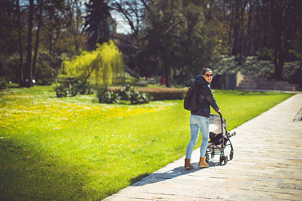 istock Beautiful women walking with her son 518226040