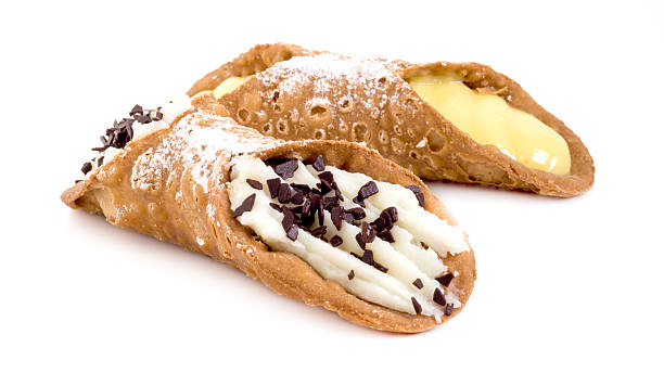 Traditional sicilian cannoli Traditional cannoli stuffed with cream cheese and custard with chocolate flakes. cannoli photos stock pictures, royalty-free photos & images