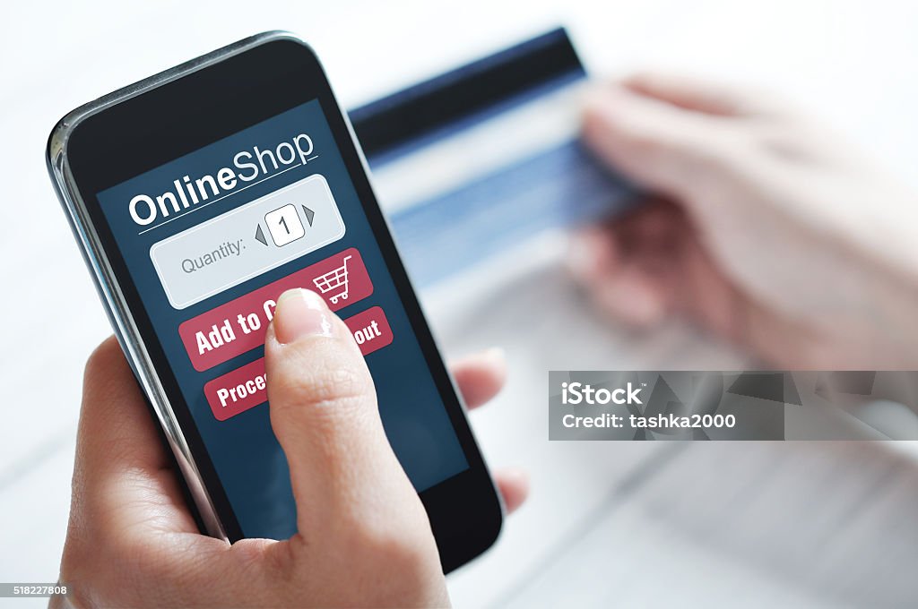 Internet shopping concept Female hands using smart phone for internet shopping Add To Cart Stock Photo