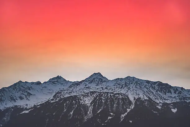 Photo of Mountain sunset with red sky