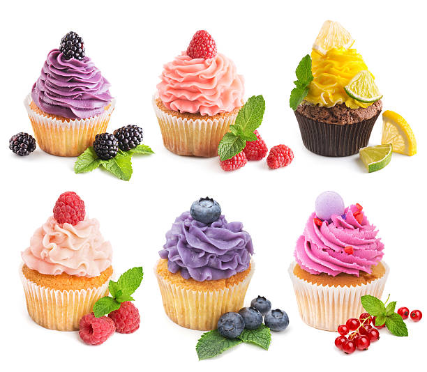 istock Collection of bright cupcakes with fresh berries isolated 518231272