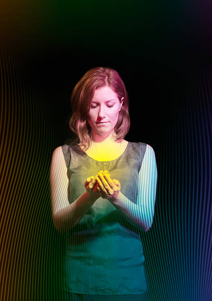 istock Girl holding illuminated orb, surrounded with abstract pattern. 518231642