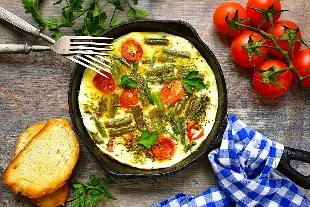 Photo of Omelet with tomatoes and asparagus bean.