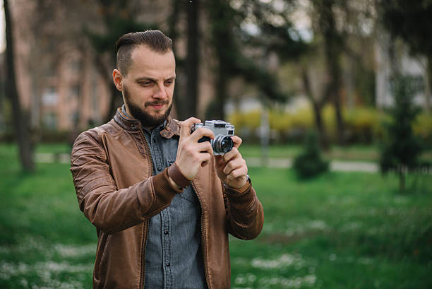 istock Young hipster photographer taking photo 518233864