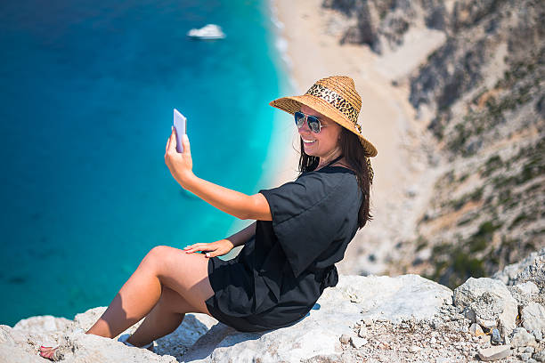 istock Women with smartphone at sea 518243548