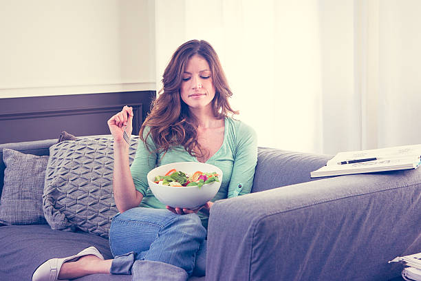 istock woman eating salad 518243980