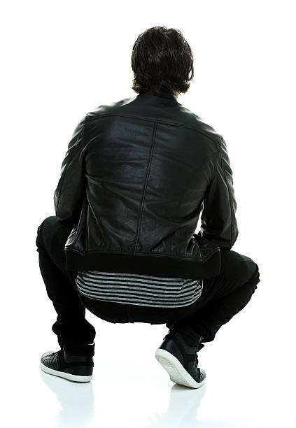 istock Rear view of man crouching 518246640