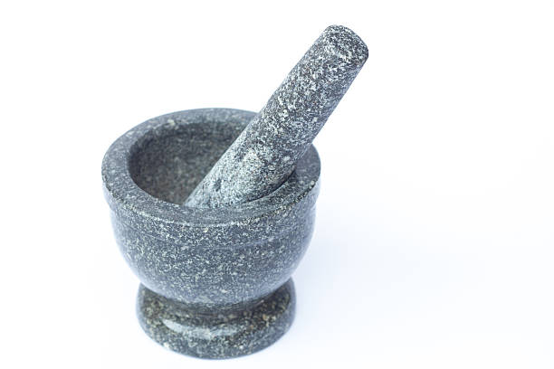 istock Stone mortar and pestle on white background 518246726