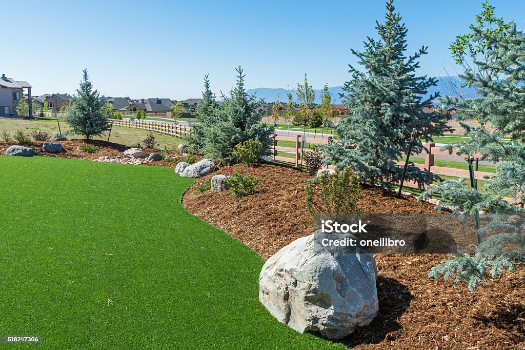 Landscaping with Artificial turf Beautiful backyard with the use of artificial turf Artificial Stock Photo