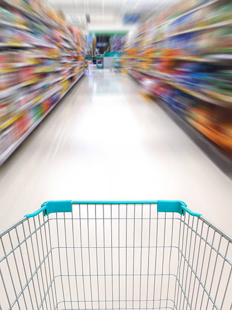 istock supermarket shelves aisle blurred background 518248088