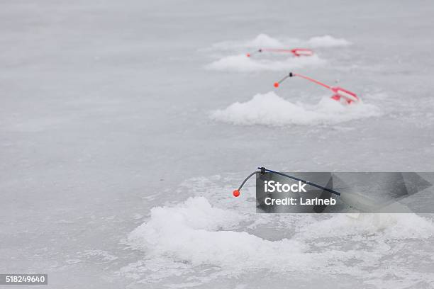 Many Of Ice Fishinng Rods On The Pond Stock Photo - Download Image Now - Adult, Arctic, Close-up