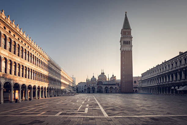 Piazza San Marco and Campanile in Venice The Campanile and Basilica San Marco in a deserted Saint Mark's Square in Venice under early morning blue skies st marks square photos stock pictures, royalty-free photos & images