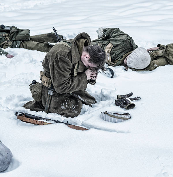 istock WWII Soldier Praying For Dead Ambushed War Casualties 518252166