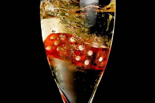 istock the red dice dropping in the champagne flute 518252460
