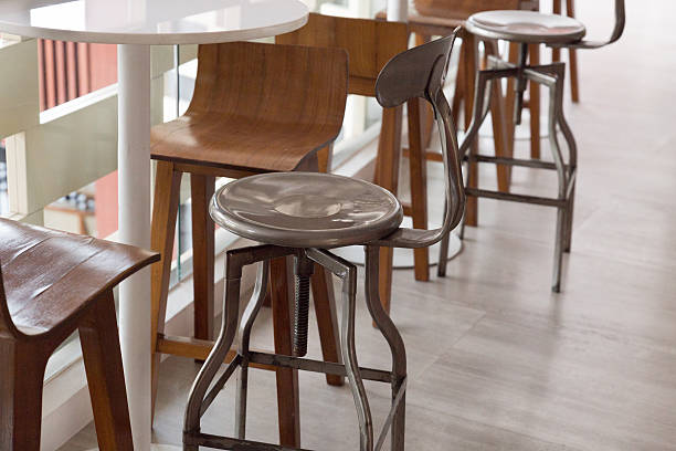 istock metal and wooden stool with round table at the balcony 518253104