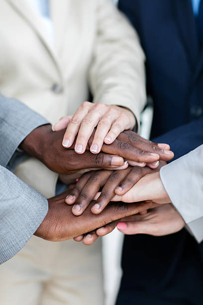 istock business people hands together 518255172