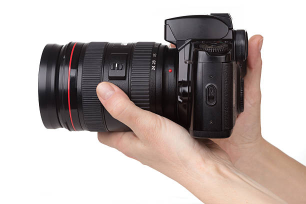 istock Female hands holding the camera 518255482