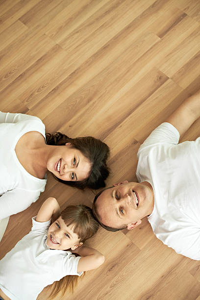 istock Family on parquet floor 518256150