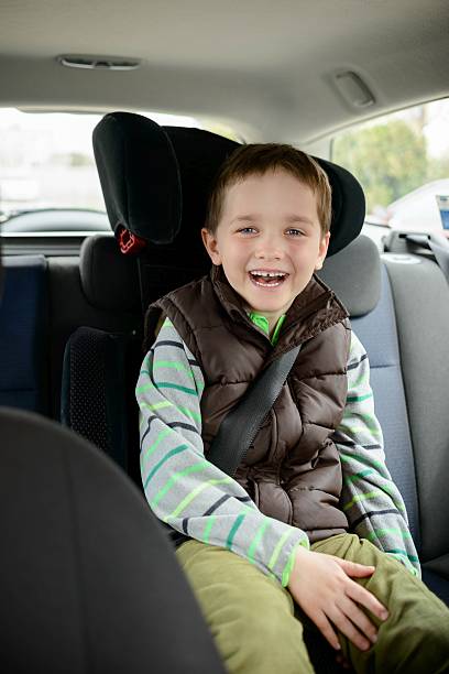istock Smiling little boy in car safety seat. 518256842