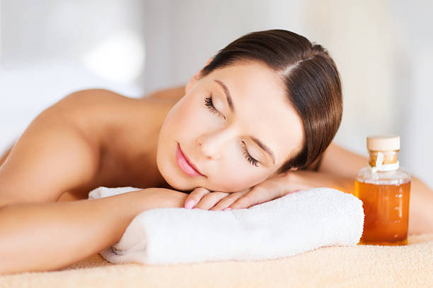 istock happy woman in spa salon 518257305