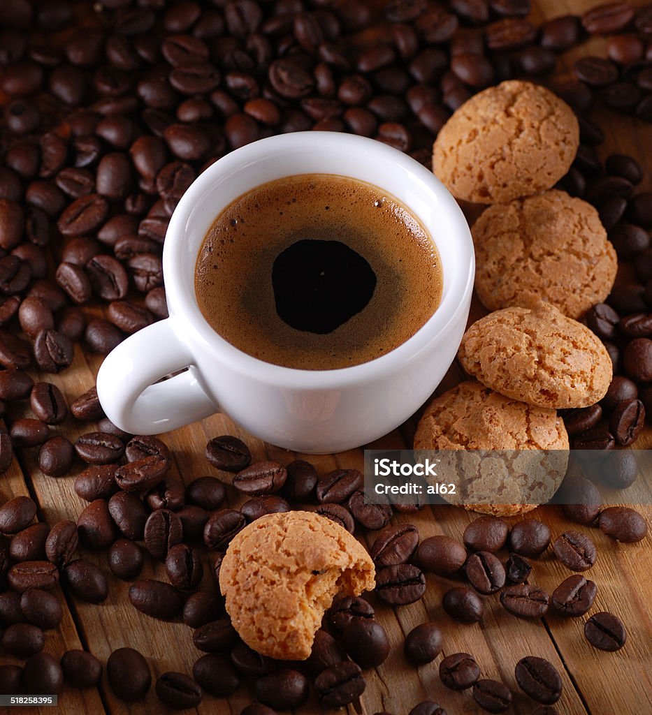 Italian espresso coffee and amaretti Italian Espresso and amaretti with coffee beans around Amaretto Liqueur Stock Photo