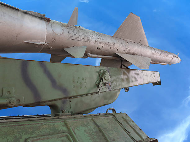 istock Old russian antiaircraft defense rocket launcher over blue sky 518259509