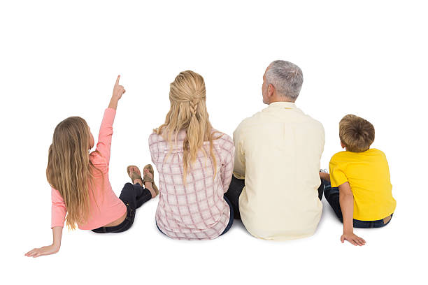 famiglia felice seduta e che - rear view family isolated child foto e immagini stock