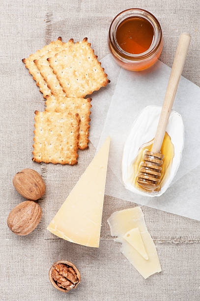 istock Camembert and parmesan cheese, honey and nuts 518260823