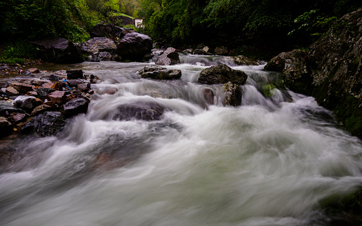 Huihang Ancient Trail Hiking Tour.  Image using slow shutter speed, waterfall and river in mountains between Anhui and Zhejiang, China