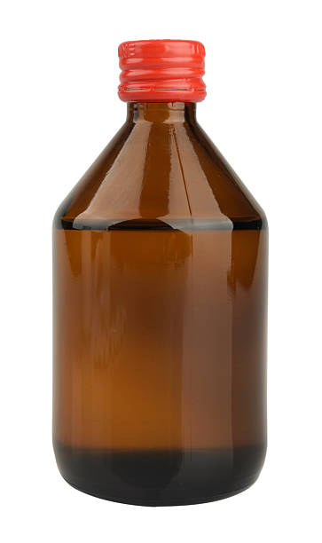 istock Liquid medicine in glass bottle isolated on white 518262173