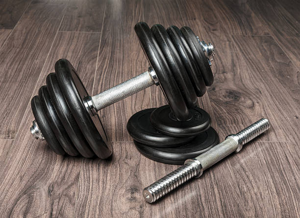 istock Dumbbell on a wooden floor 518262455