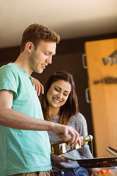 istock Cute couple preparing food together 518263657