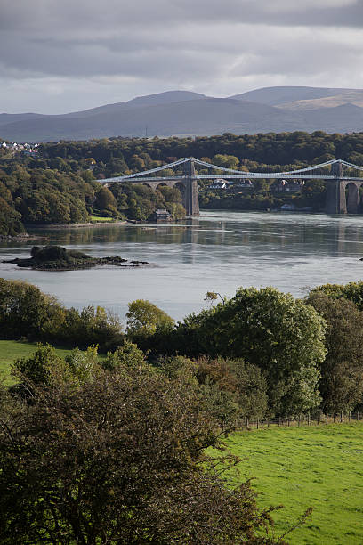 istock Bridge in Anglesy Wales with river and mountains 518271234