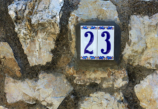 House number 23, made in ceramic and hand painted. Spain.