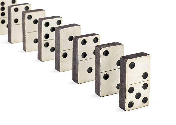 istock row of old dominoes 518273248
