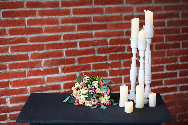 istock Many old white candles on old black table 518274050