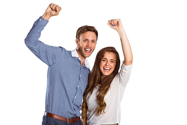 istock Happy young couple cheering 518274649