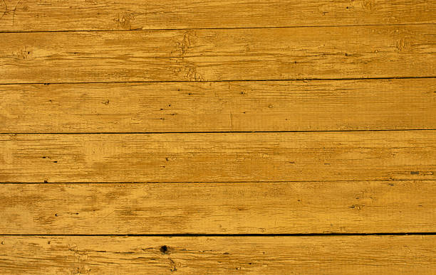 istock Yellow weathered wooden wall texture. 518276270
