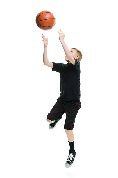 istock Little boy playing basketball 518277304